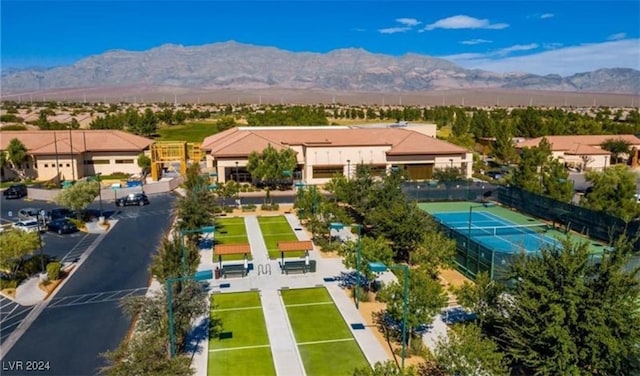 birds eye view of property with a mountain view