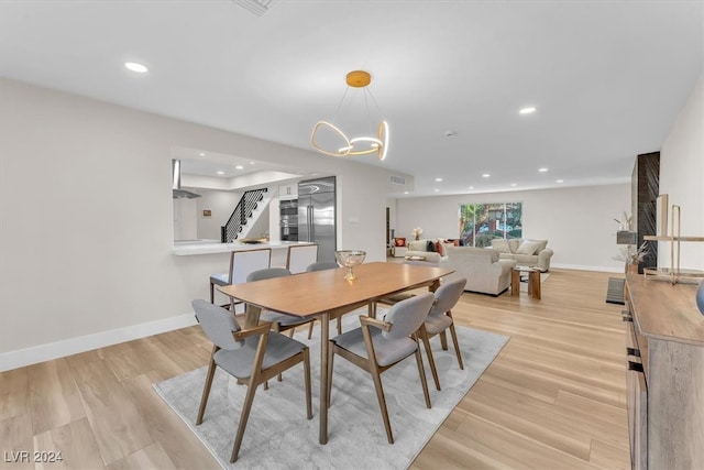 dining room featuring baseboards, visible vents, stairway, light wood-type flooring, and recessed lighting