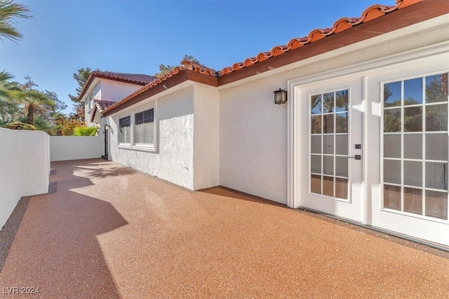 view of patio with fence and french doors