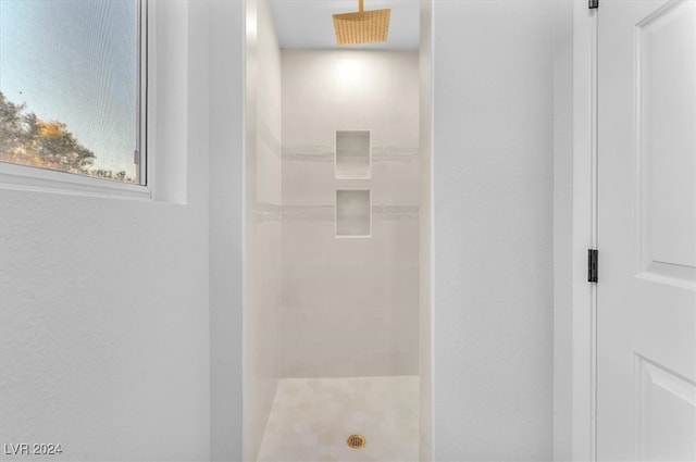 full bathroom with tiled shower