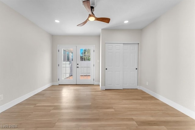 entrance foyer with light wood-type flooring, french doors, baseboards, and recessed lighting