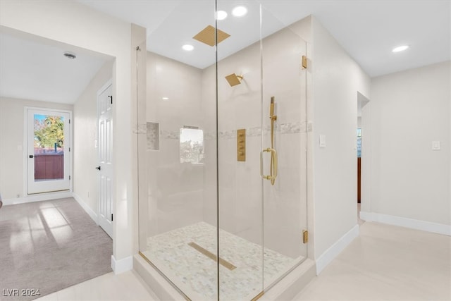 full bath with a stall shower, baseboards, and recessed lighting