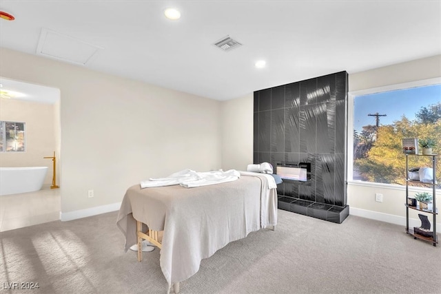 bedroom featuring baseboards, light colored carpet, visible vents, and attic access