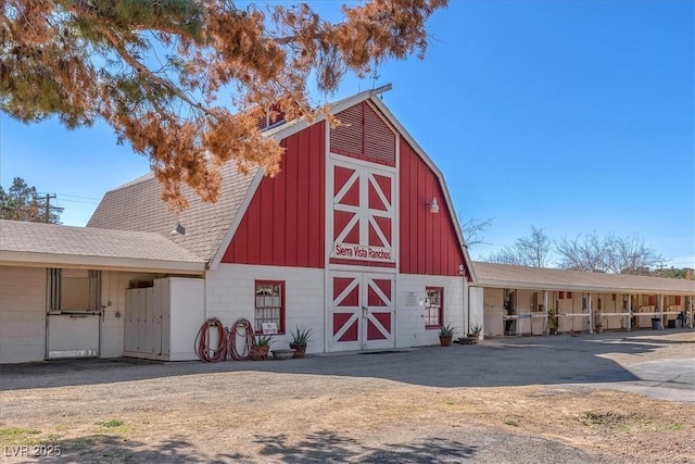 view of barn featuring an exterior structure