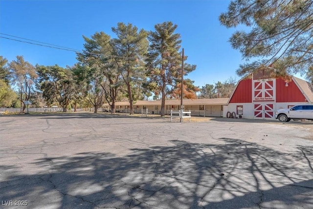 view of street featuring a barn