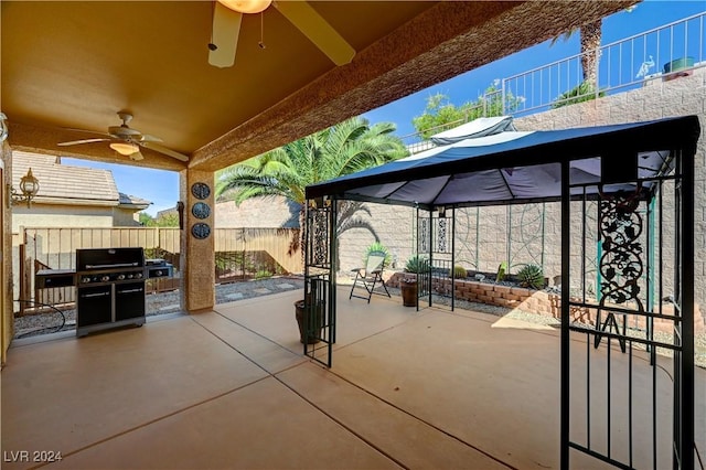 view of patio featuring a ceiling fan and fence