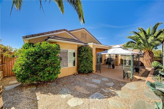 exterior space with a gazebo and fence