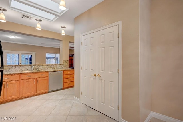 bathroom featuring tile patterned flooring, vanity, visible vents, baseboards, and a closet