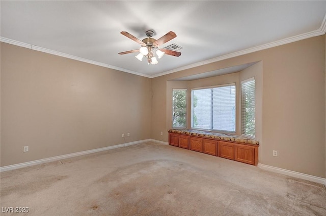 unfurnished room with light carpet, visible vents, and crown molding