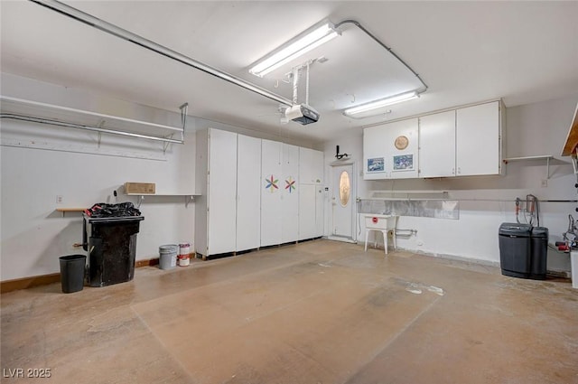 garage featuring baseboards and a garage door opener