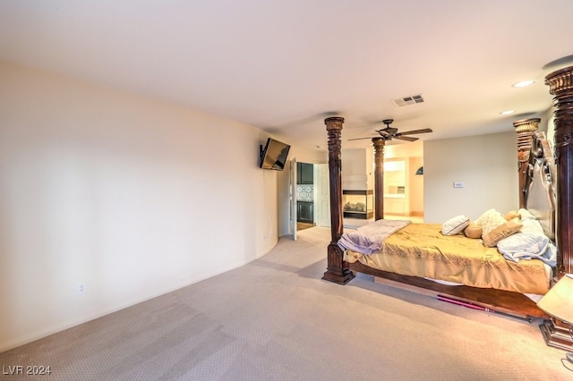 bedroom with light carpet and ceiling fan