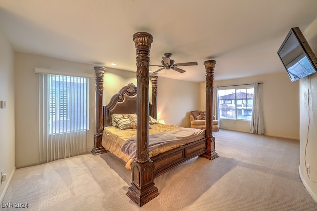 bedroom featuring ceiling fan and light colored carpet