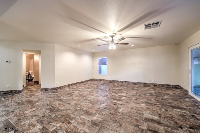 spare room with ceiling fan