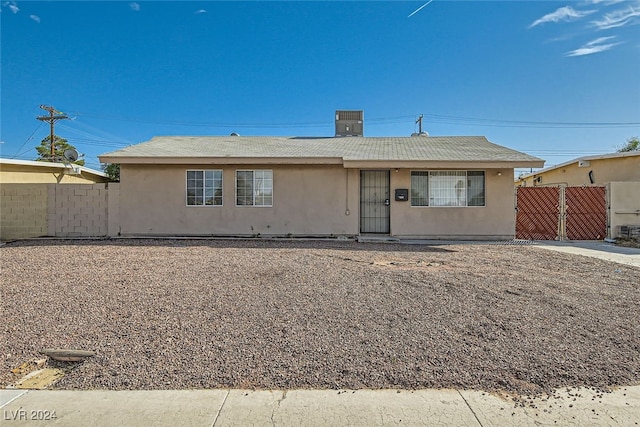 ranch-style house with central air condition unit