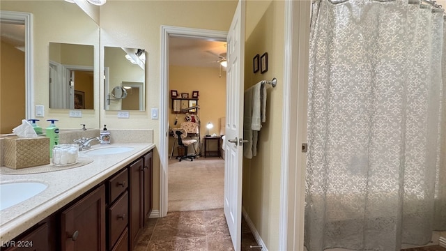 bathroom featuring vanity and ceiling fan