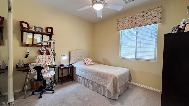 bedroom featuring light carpet and ceiling fan