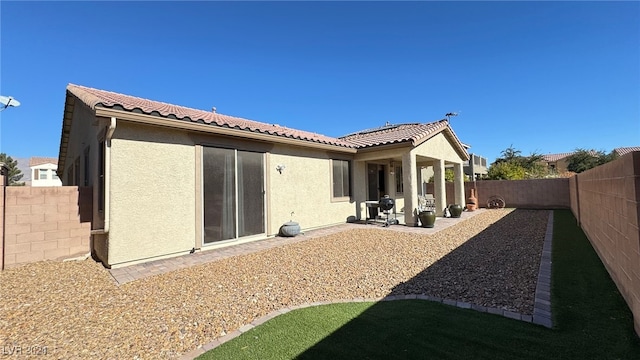 back of house with a patio area