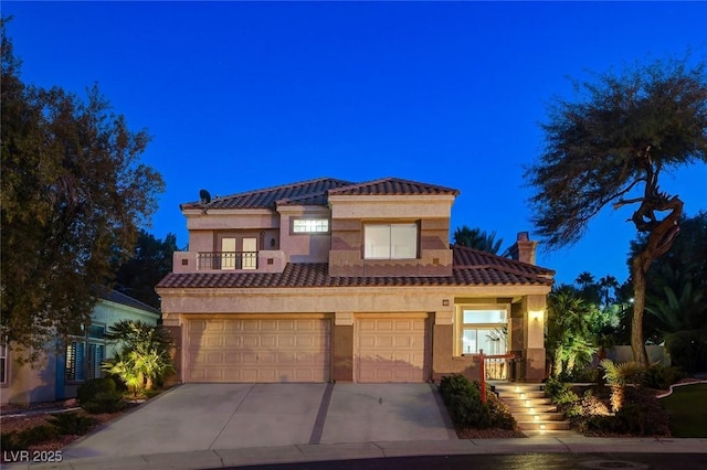 mediterranean / spanish-style home featuring a garage