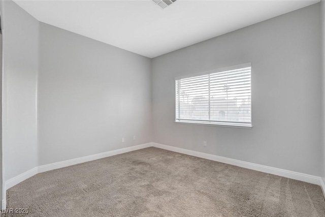 unfurnished room with light carpet