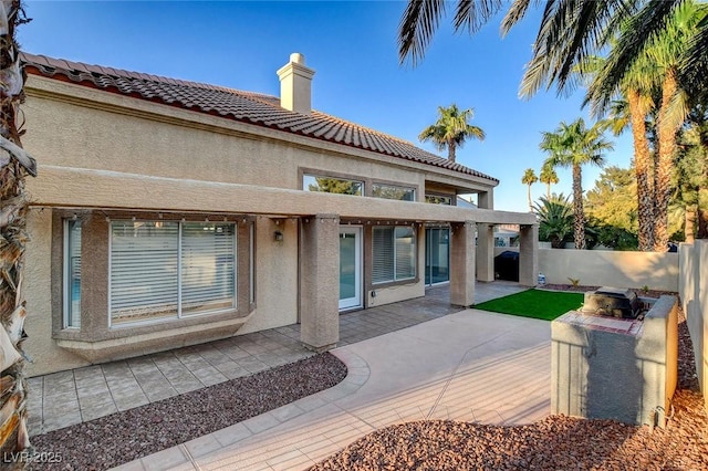 rear view of house with a patio area