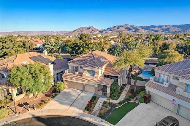 birds eye view of property with a mountain view