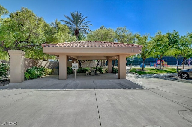 view of vehicle parking with a gazebo