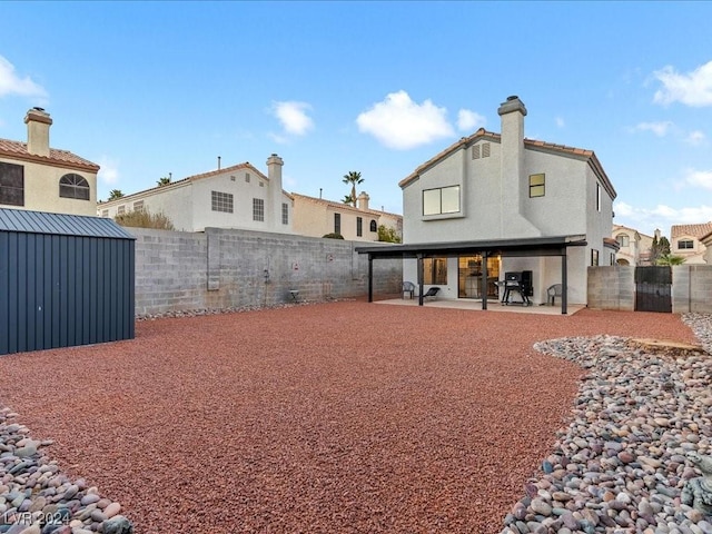 rear view of house featuring a patio