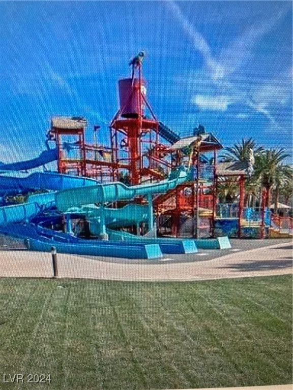 view of jungle gym with a lawn