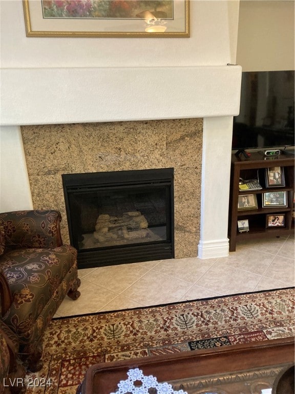 room details with a fireplace and tile patterned flooring