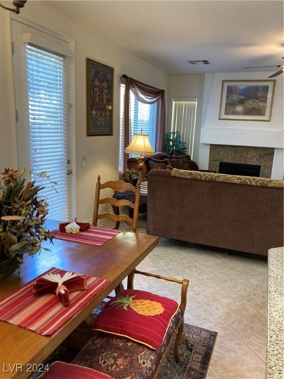 dining room featuring ceiling fan and light tile patterned floors