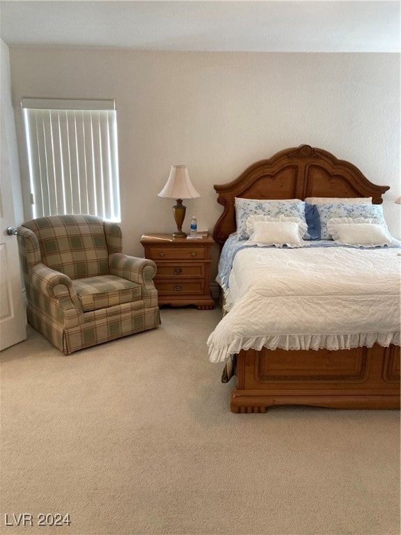 bedroom featuring light colored carpet