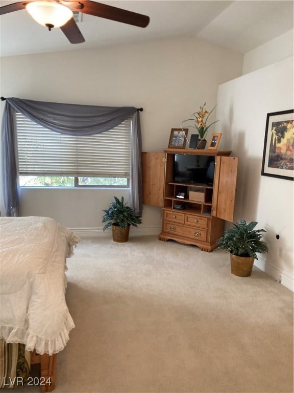 carpeted bedroom with lofted ceiling and ceiling fan