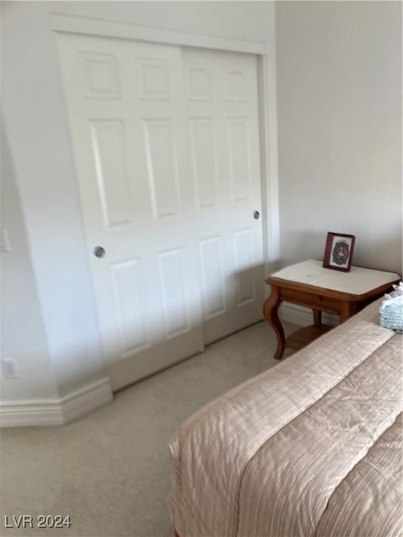 carpeted bedroom featuring a closet