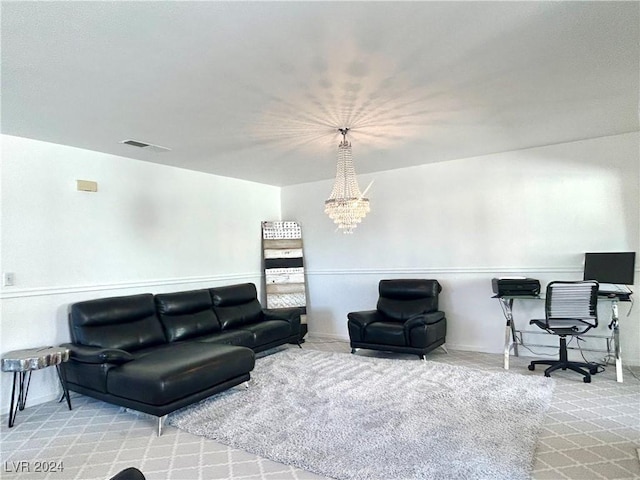 carpeted living room featuring an inviting chandelier