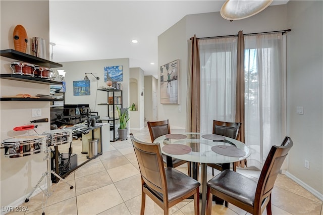 dining area featuring light tile patterned floors