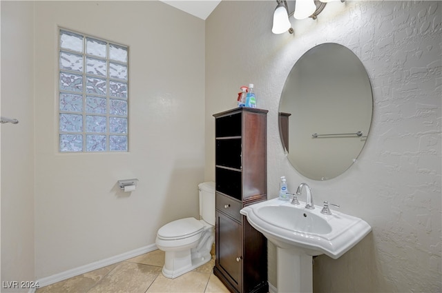 bathroom featuring tile patterned flooring and toilet