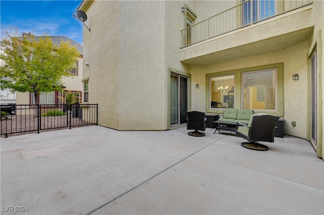 view of patio / terrace featuring an outdoor living space and a balcony