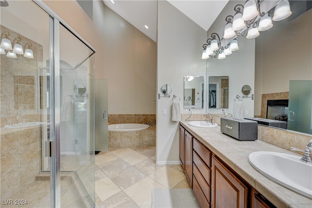 bathroom featuring high vaulted ceiling, vanity, shower with separate bathtub, and tile patterned flooring