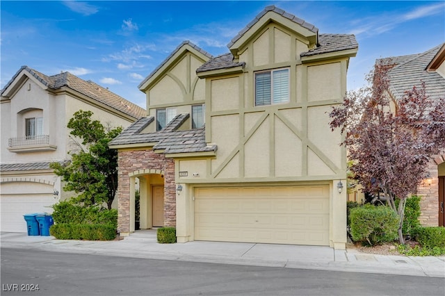 tudor-style house with a garage