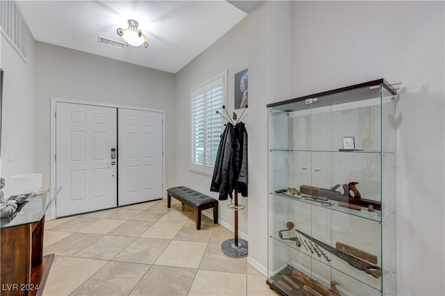 foyer entrance featuring light tile patterned floors