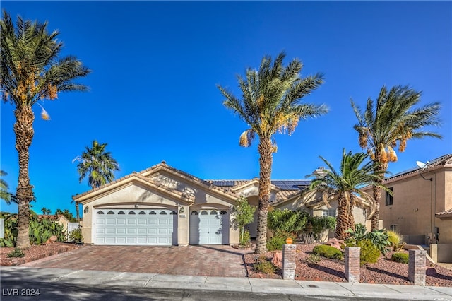 view of front of property with a garage