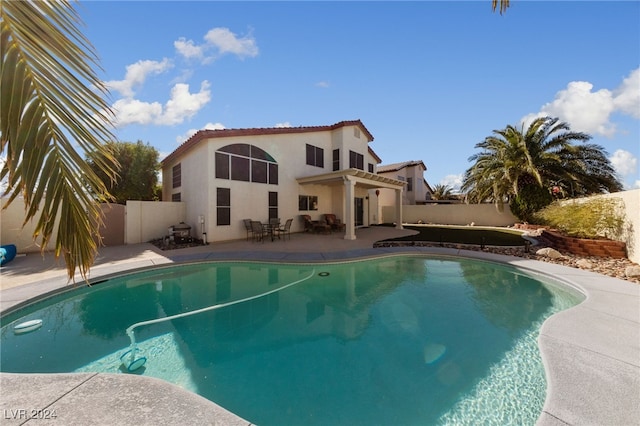 view of swimming pool with a patio area