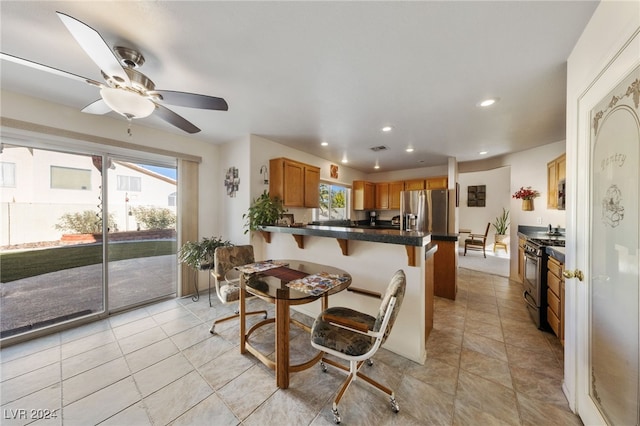 dining room with plenty of natural light and ceiling fan