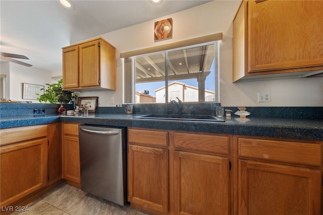 kitchen featuring dishwasher, sink, ceiling fan, and light tile patterned flooring