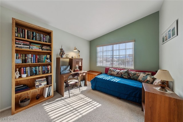 carpeted bedroom featuring lofted ceiling