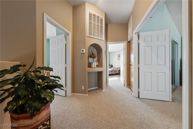 hallway with light carpet