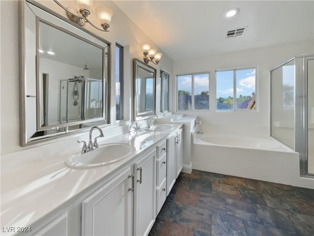 bathroom featuring vanity and shower with separate bathtub