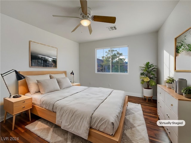 bedroom with dark wood-type flooring and ceiling fan