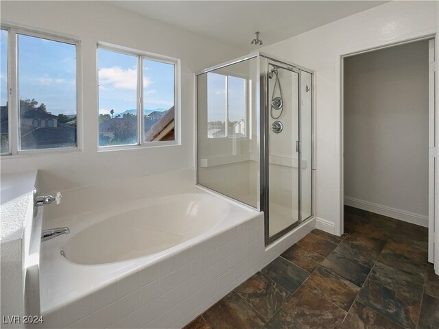 bathroom featuring plus walk in shower