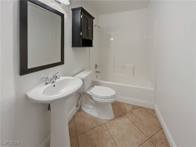 bathroom featuring tile patterned flooring, toilet, and shower / bathtub combination